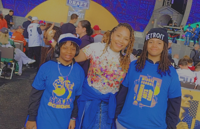  Art Teacher, Ms. Coffee and students posing in Spain Gear at the NFL Draft